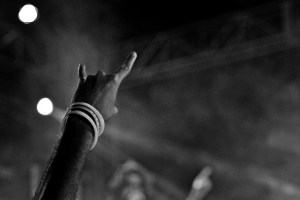 hand in air with devil horns black white rock